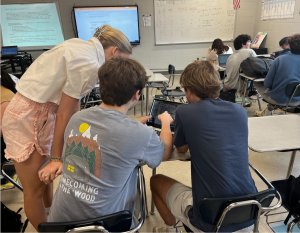 Students collaborate in Major's class on their computer science work.  